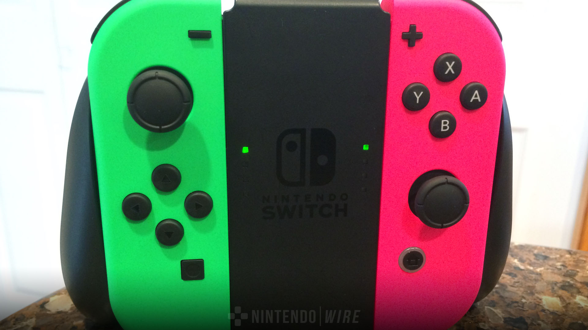 nintendo switch with pink and green