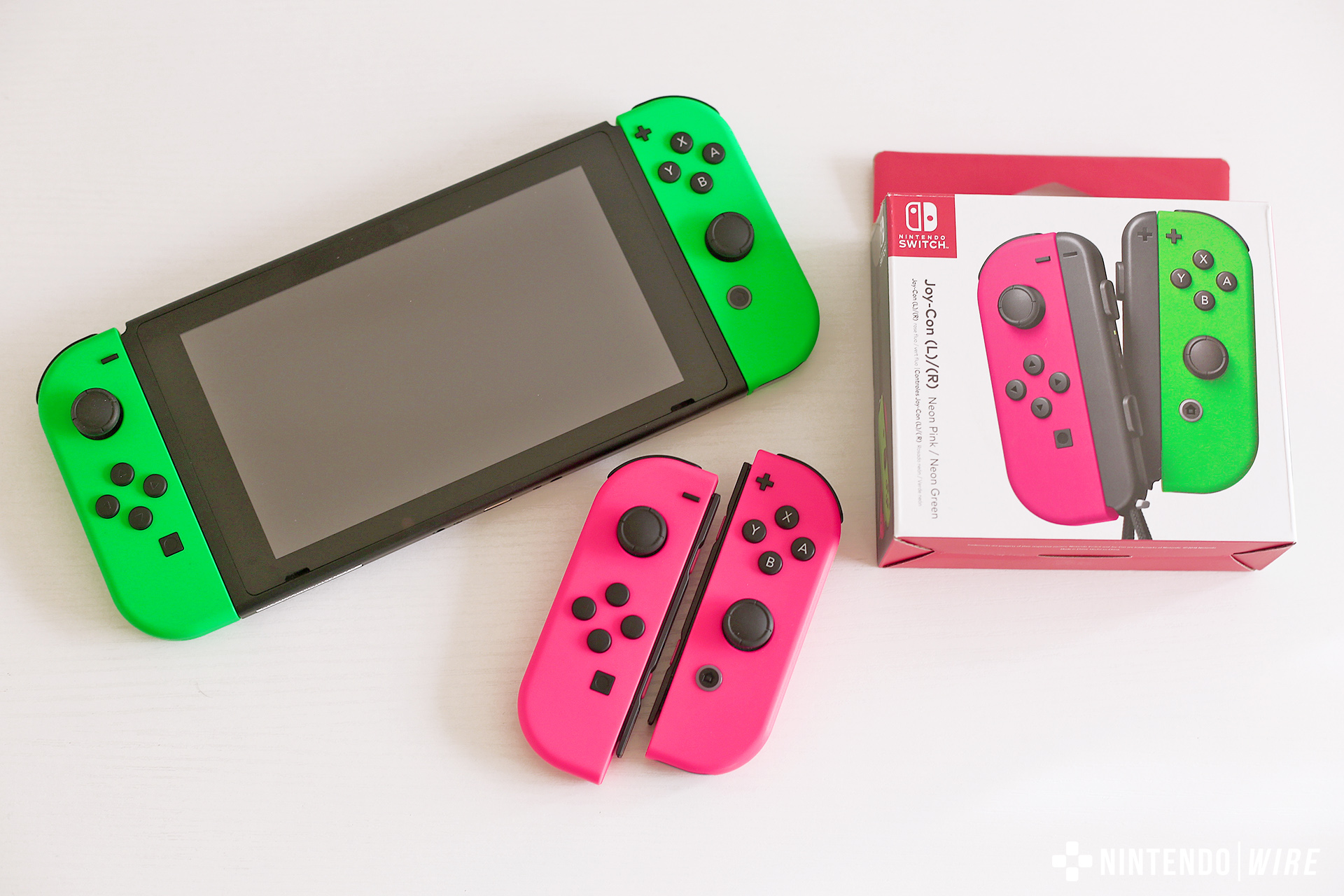 nintendo switch with green and pink