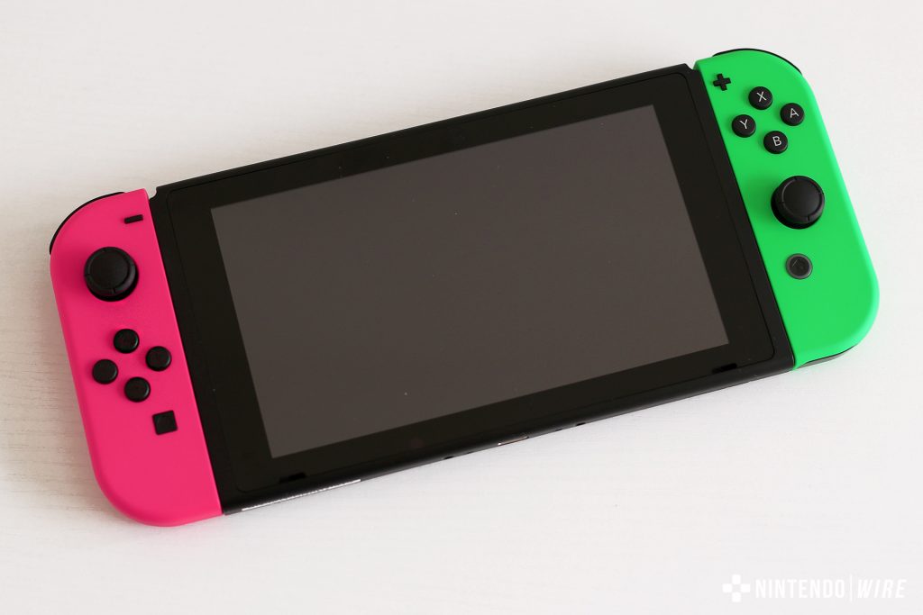 nintendo switch with pink and green